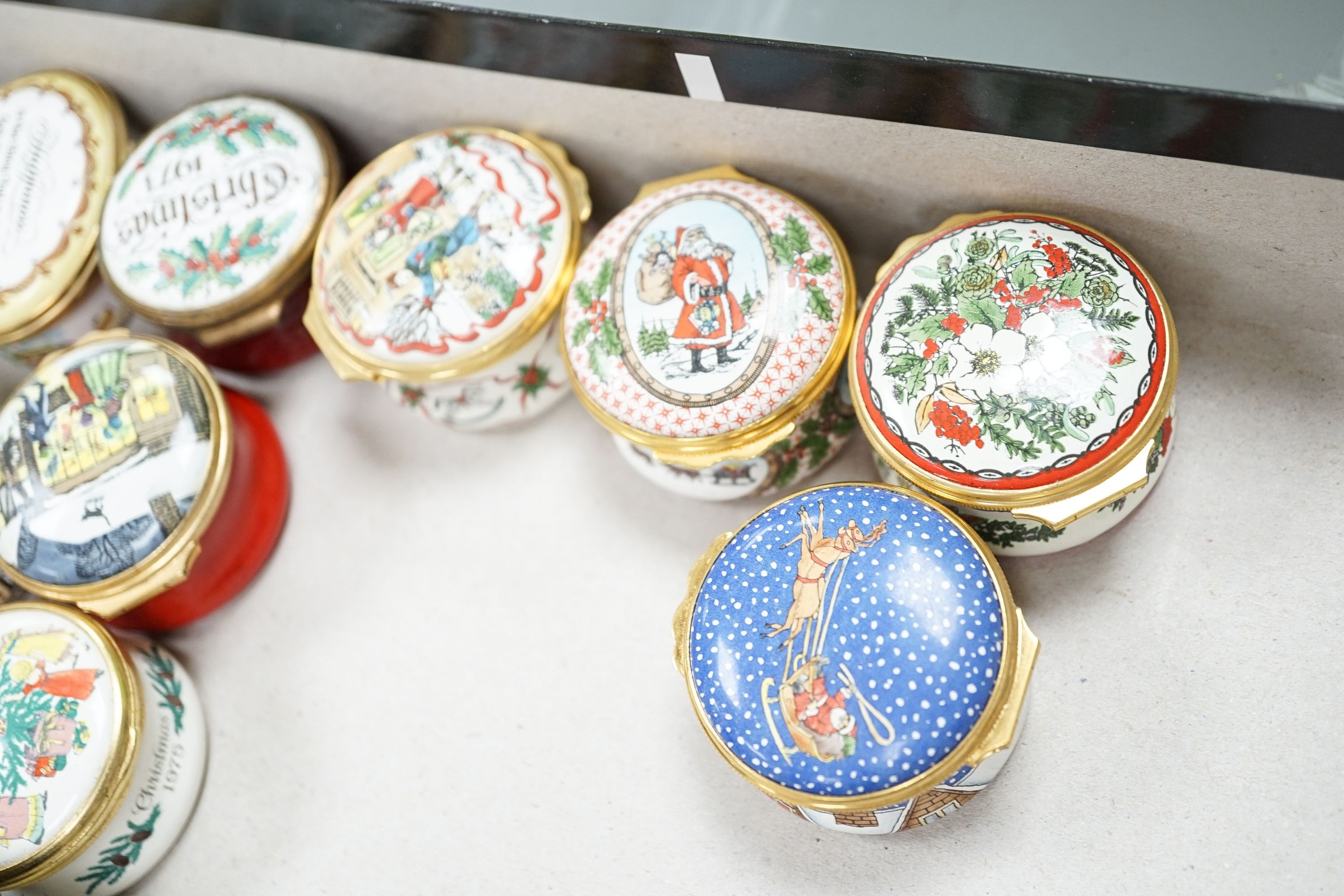 A collection of enamel patch boxes including Halcyon Days